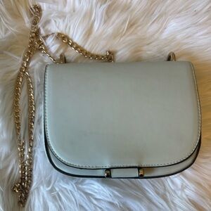 Light blue crossbody small bag on a gold chain